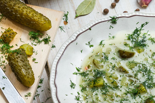Zupa Ogórkowa: Polish dill pickle soup on a white plate