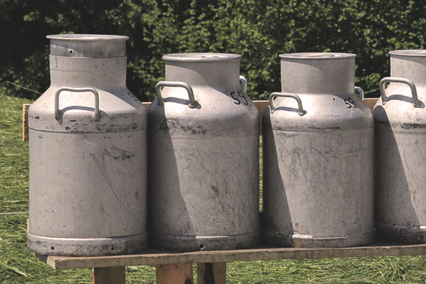 Milk cans stored outdoors