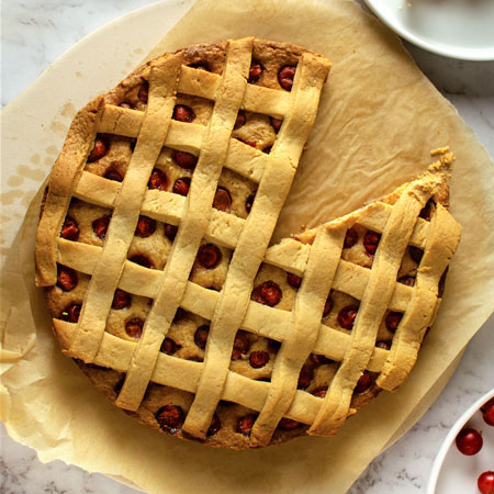 Flat lay Gooseberry Pie with Lattice on white background