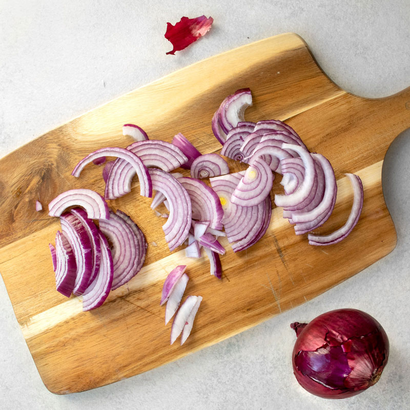 chopped red onions on a cutting board