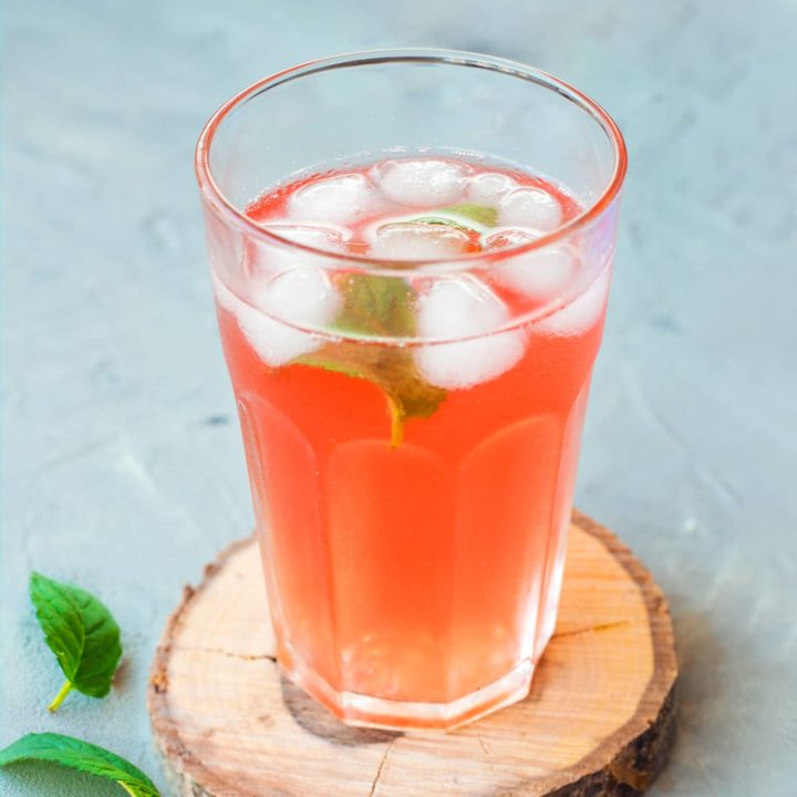 A glass of cold Polish rhubarb drink with honey and mint
